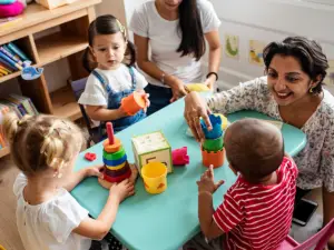 Preschool teacher interacts with children